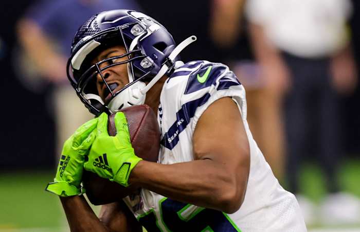 Seattle Seahawks wide receiver Tyler Lockett (16) catches a touchdown pass against New Orleans Saints cornerback Paulson Adebo (29) during the second half at Caesars Superdome.